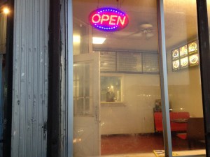 Looking through the windows at Young Kong. See those candy machines in the corner on the right? The angle at which this picture was taken might suggest there is more room inside to the left. There isn't.