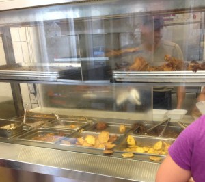 The display case for some of the food. Plantains, chicken, and chicharron.