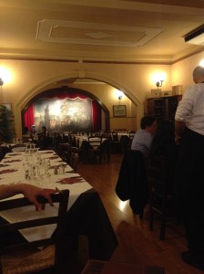 The dining area in the restaurant. Notice the mural in the back.